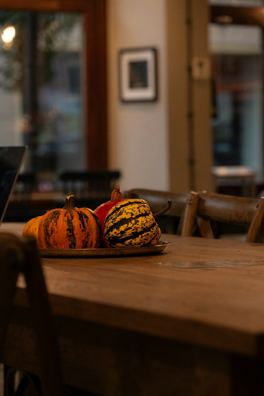 Wild mushrooms apples and pumpkins on a wooden table