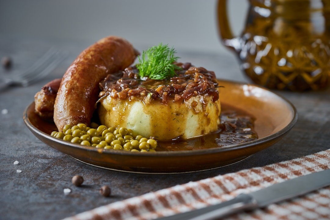 Traditional Czech svíčková with bread dumplings on a wooden table