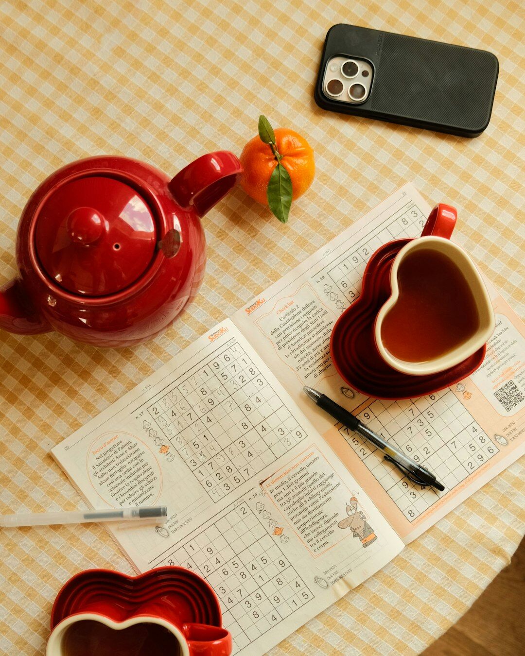 Cozy kitchen table set with notebook and tea