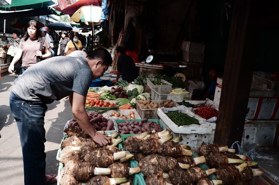 selecting fresh vegetables at market